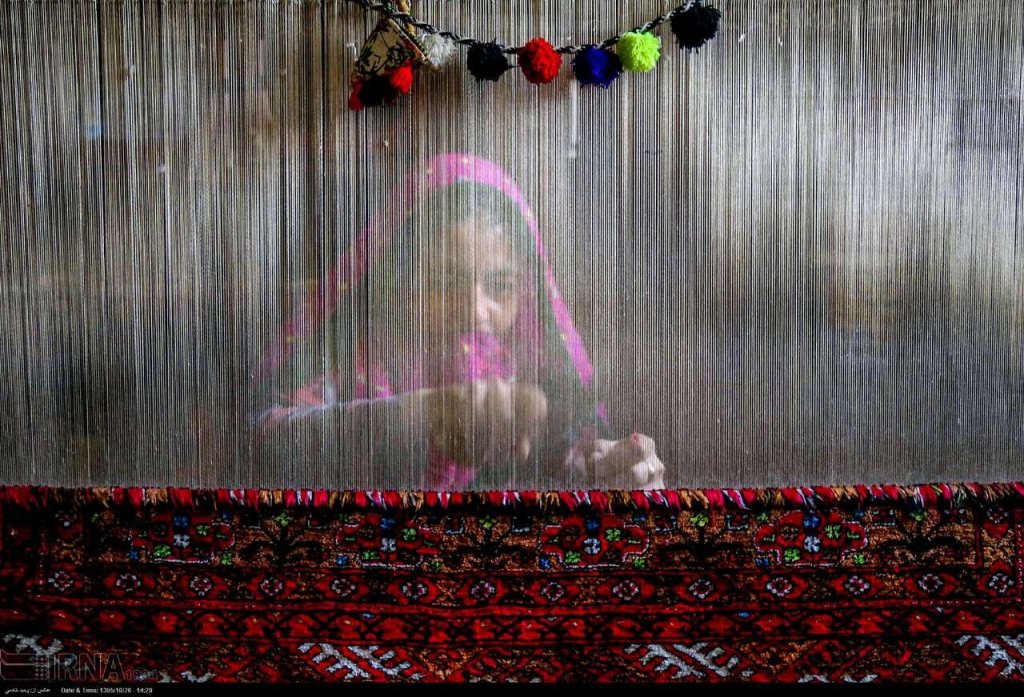 Persian carpet weaver in Iran